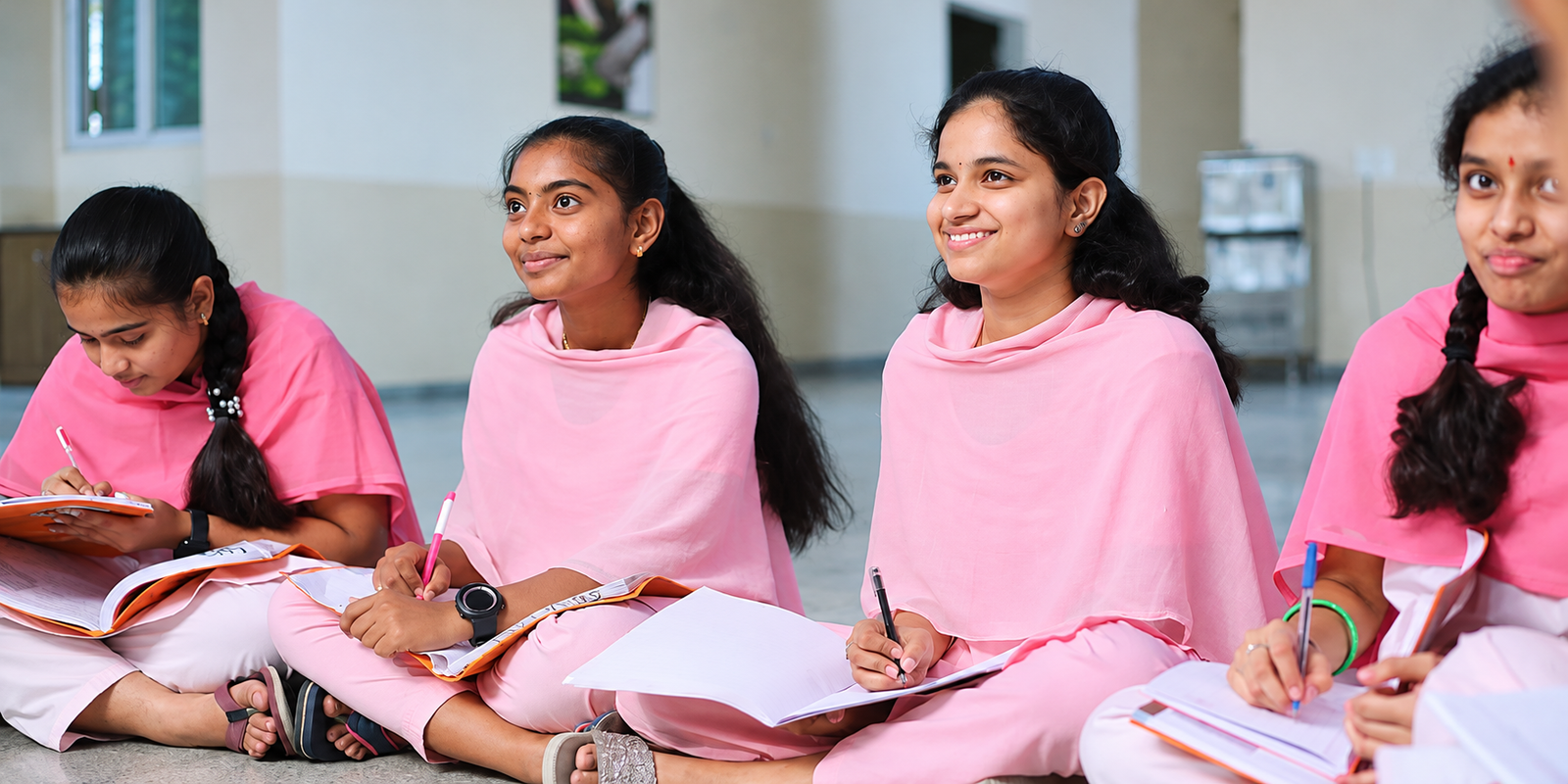Students Studying in a Bright Corridor